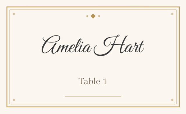 Place card reading Amelia Hart, Table 1, on a cream card with a gold frame